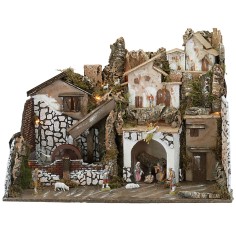 Presepe con statue illuminato con mulino completo di pompa a