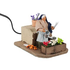 Donna che annaffia 10 cm in movimento per presepe Mondo Presepi 2