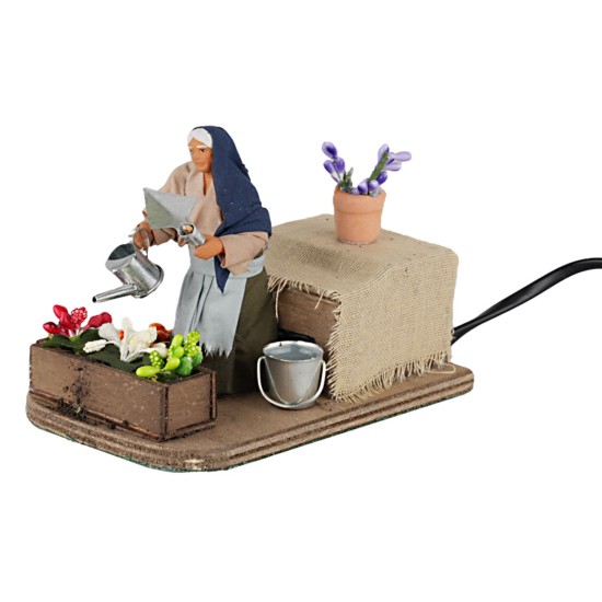 Donna che annaffia 10 cm in movimento per presepe Mondo Presepi