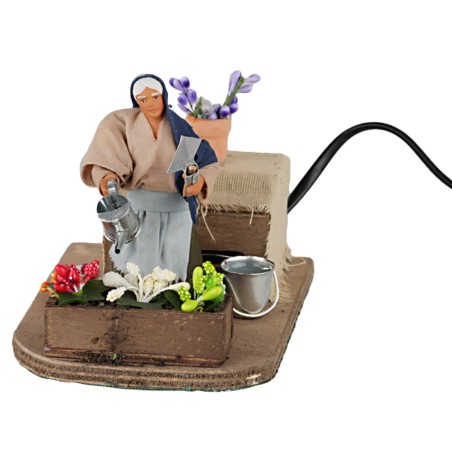 Donna che annaffia 10 cm in movimento per presepe Mondo Presepi