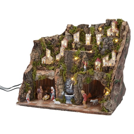 Pesebre completo con estatuas, luces y fuente en funcionamiento completo