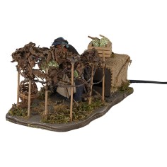 Donna che raccoglie l'uva 12 cm in movimento per presepe Mondo 2