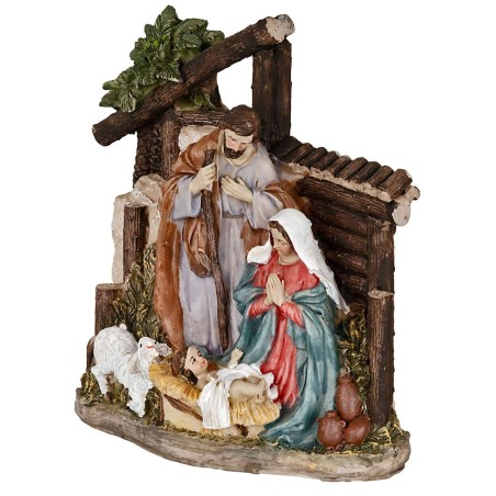 Nativity in resin with Saint Joseph, Mary kneeling, Baby Jesus in the manger, and a little sheep.
