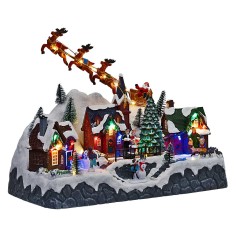 Christmas scene with Santa Claus on a sleigh pulled by reindeer