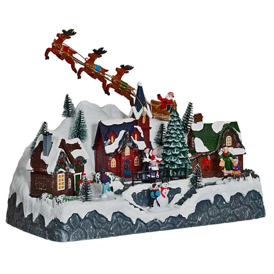 Christmas scene with Santa Claus on a sleigh pulled by reindeer