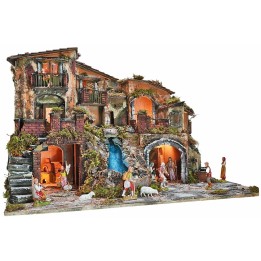 Illuminated nativity scene complete with statues with waterfall, fountain and