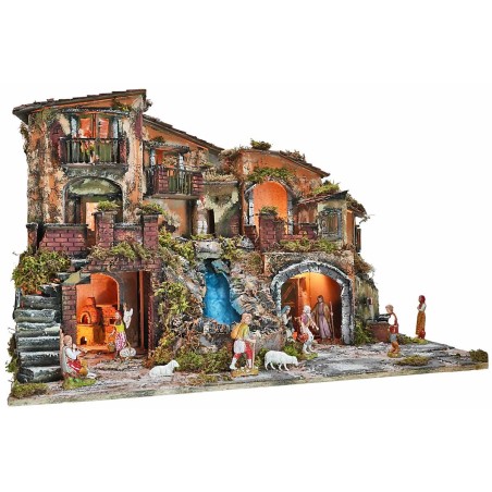 Illuminated nativity scene complete with statues, waterfall, fountain, and