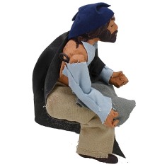 Uomo seduto serie cm 14 con braccio su-giù per presepe Mondo 2
