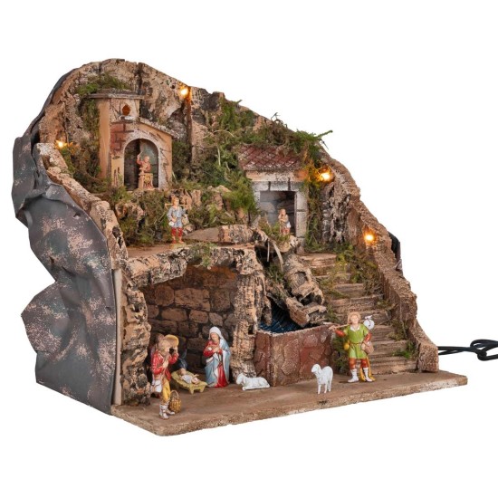 Illuminated nativity scene complete with waterfall and statues