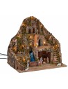Illuminated nativity scene with stream and moving donkey