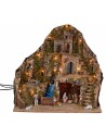 Illuminated nativity scene with stream and moving donkey