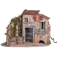 Group of rustic houses at the corner with a Nasone fountain