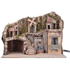 Illuminated nativity scene with a windmill and fountain powered 2