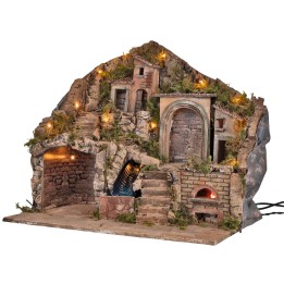 Illuminated nativity scene with electric-powered oven and working waterfall