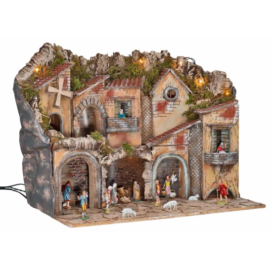 Illuminated nativity scene with arches, oven, mill, and
