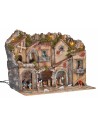 Illuminated nativity scene with arches, oven, mill, and