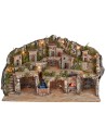Belén iluminado con cuevas, casitas, arroyo y horno