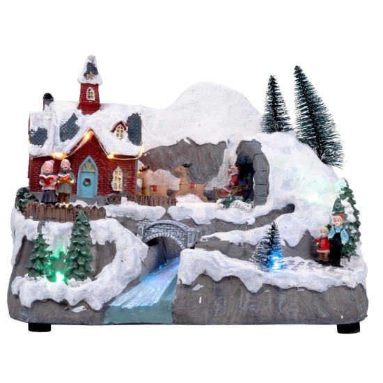 Christmas village with moving sleigh complete with lights and