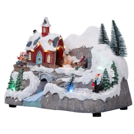 Pueblo de Navidad con trineo en movimiento completo de luces y