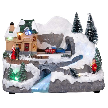 Christmas carousel with moving train and stream with house