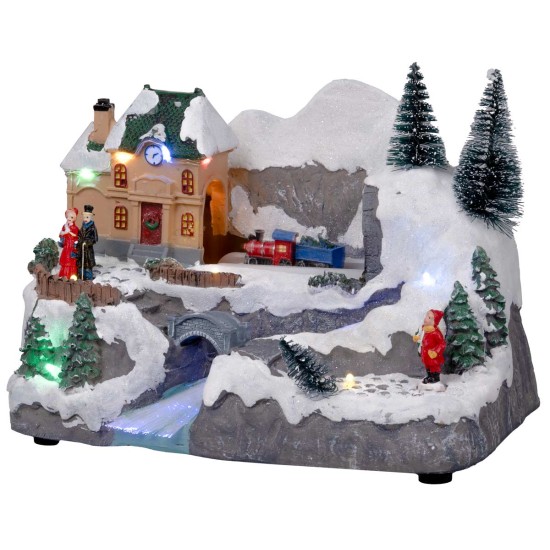 Christmas carousel with moving train and stream with house