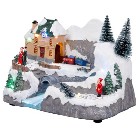 Christmas village with moving train equipped with lights and