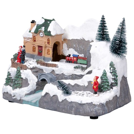 Christmas village with moving train equipped with lights and
