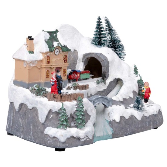 Christmas carousel with moving train and stream with house