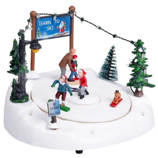 Christmas carousel with ice skating rink complete with lights and