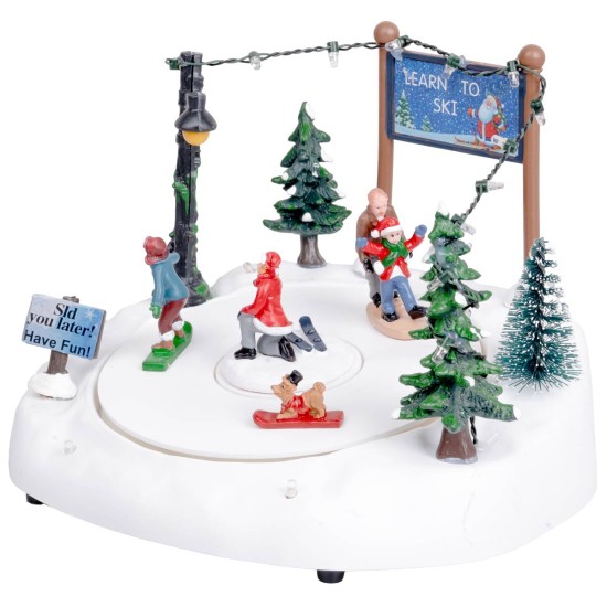 Christmas carousel with ice skating rink complete with lights and