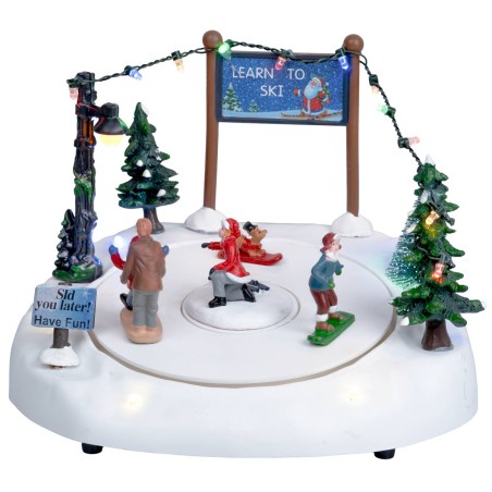 Christmas carousel with ice skating rink complete with lights and