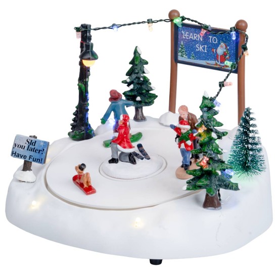 Christmas carousel with ice skating rink complete with lights and