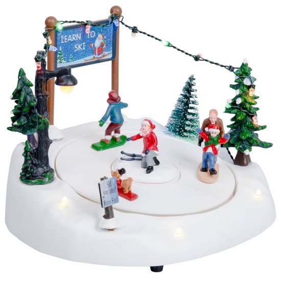 Christmas carousel with ice skating rink complete with lights and