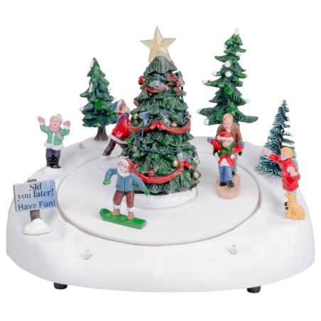 Carrusel navideño con pista de patinaje y árbol de Navidad