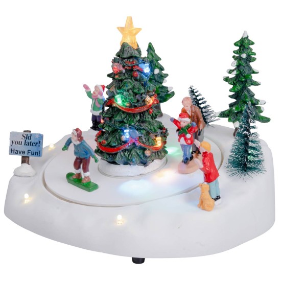 Ice skating rink with Christmas tree complete with light and
