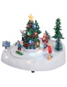 Carrusel navideño con pista de patinaje y árbol de Navidad