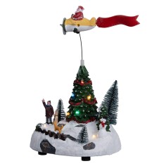 Christmas carousel with Santa Claus on a moving airplane