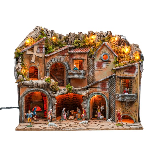 Illuminated nativity scene with arches, oven, mill, and