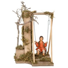 Bambino su altalena serie 12 cm in movimento per presepe Mondo