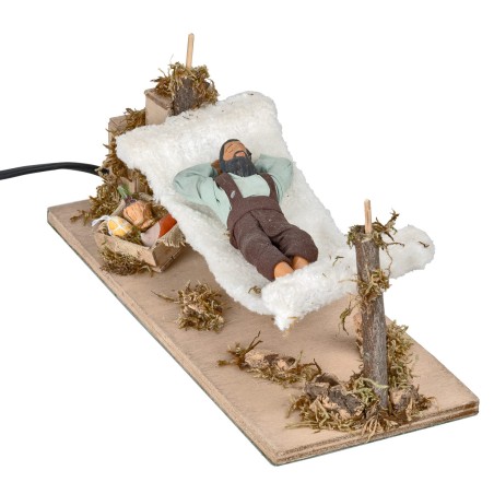 Man sleeping on hammock series 12 cm moving for nativity scene
