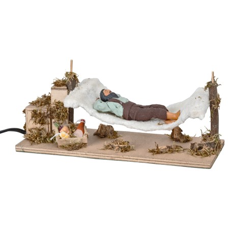 Man sleeping on hammock series 12 cm moving for nativity scene