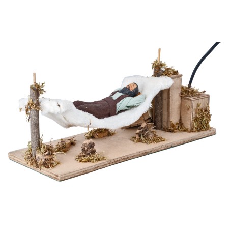Man sleeping on hammock series 12 cm moving for nativity scene