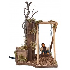 Bambino su altalena in movimento 12 cm per presepe Mondo Presepi