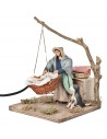 Mamma con bambino nella cesta in movimento 12 cm per presepe