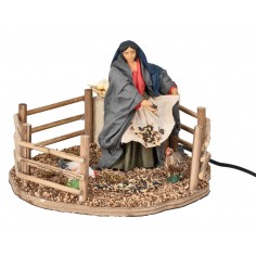 Peasant woman feeding chickens in motion 12 cm for nativity scene