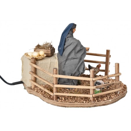 Campesina que alimenta las gallinas en movimiento 12 cm para belén