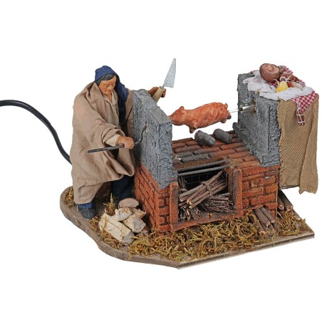 Hombre que gira la porchetta en movimiento con horno de 12 cm para