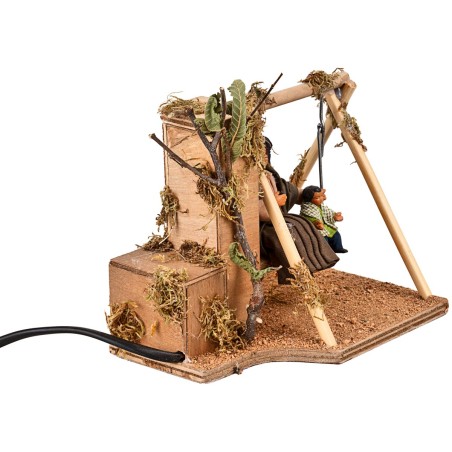 Mamma e bimbo sull'altalena in movimento 10 cm per presepe