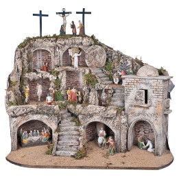 Illuminated Easter nativity scene complete with statues with