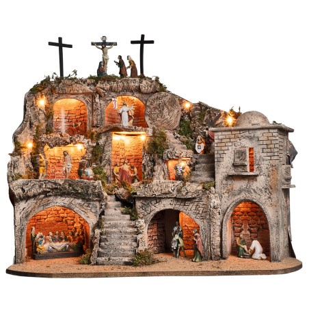 Illuminated Easter nativity scene complete with statues with